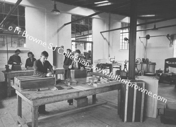 TRAVEL GOODS LTD IN FACTORY CUTTING FIBRE FOR SUITCASE FOLDING